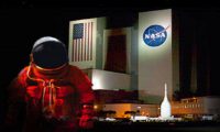 NASA-KSC NASA space suit in front of building