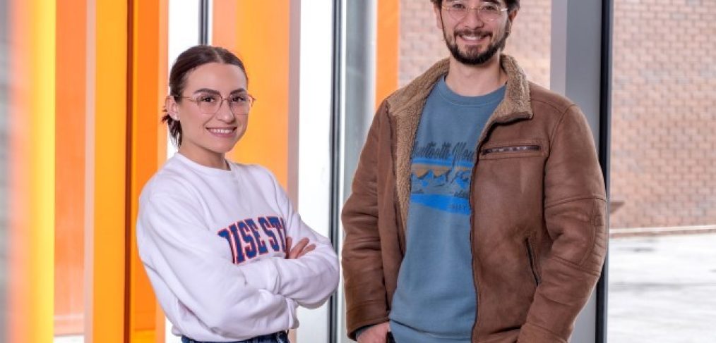 Doctoral student Cyrus Koroni from Inglewood, California, and undergraduate Ally Almaraz from Caldwell, Idaho, study in the College of Engineering’s Micron School of Materials Science and Engineering, posed, standing and smiling in a campus building