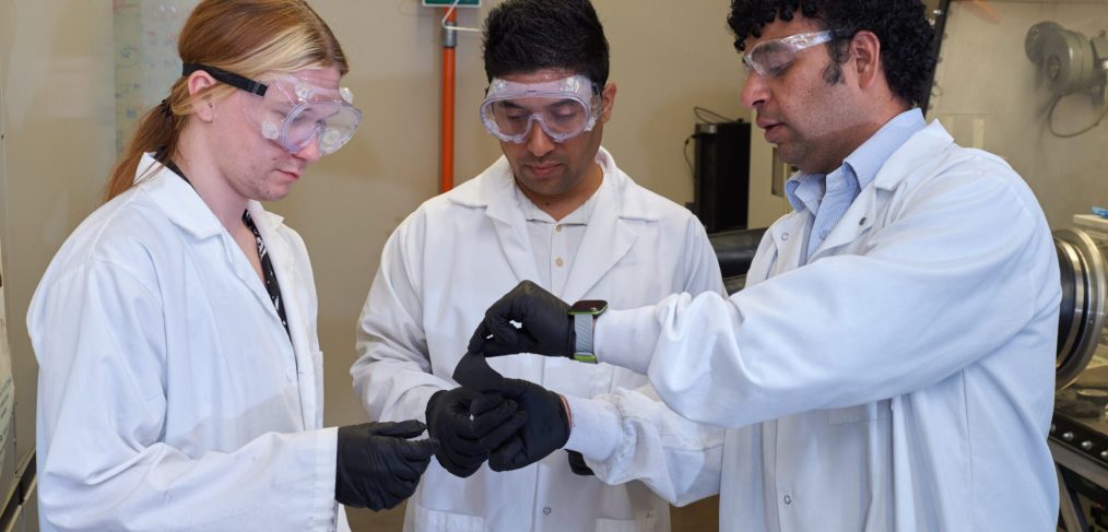 Alan Rowland (left) will study different polymers with varying nitrogen content to try to understand how significant a role nitrogen plays in how lithium-sulfur batteries work. He is shown with Nawraj Sapkota (middle) and Ramakrishna Podila, an associate professor in the Department of Physics and Astronomy.
