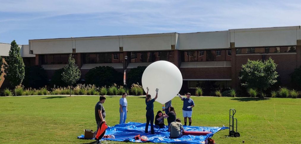 Engineering students practice launching a tethered high-altitude balloon Sept. 23 on the Macon campus.