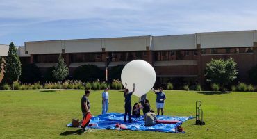 Engineering students practice launching a tethered high-altitude balloon Sept. 23 on the Macon campus.