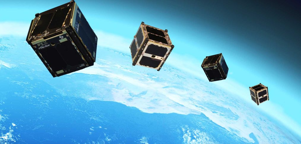 CubeSats in space with Earth in background