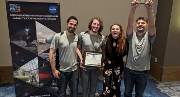 University of Utah team members John Otero (co-team lead), Christian Norman, Olivia Dale, and Collin Andersen (team lead), presented at the 2023 BIG Idea Challenge Forum, held in Cleveland, OH. The University of Utah team, partnering with Powder Metallurgy Research Laboratory, earned the Artemis Award, which represents top honors in the 2023 Big Idea Challenge. Credit: National Institute of Aerospace