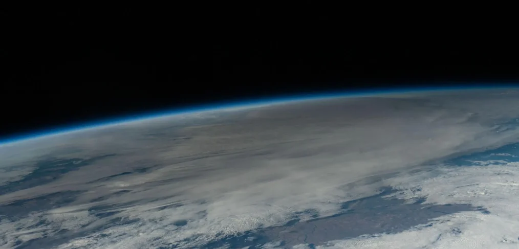 In this photo taken from the International Space Station, the Moon passes in front of the Sun casting its shadow, or umbra, and darkening a portion of the Earth's surface above Texas during the annular solar eclipse Oct. 14, 2023.