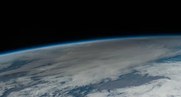 In this photo taken from the International Space Station, the Moon passes in front of the Sun casting its shadow, or umbra, and darkening a portion of the Earth's surface above Texas during the annular solar eclipse Oct. 14, 2023.