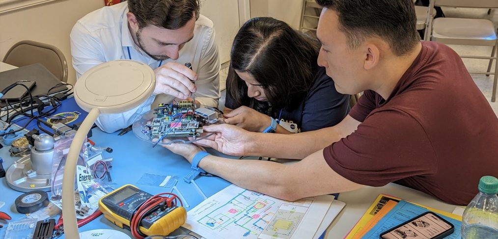 A team from Penn State Harrisburg spent a week at a NASA facility over the summer, building a scientific experiment and sending it to space through the RockOn! program. Penn State Harrisburg students Neil Lerch, a graduate student in electrical engineering, and Trent Townsend, a mechanical engineering major, and University Park student Sara Jambhekar, who is studying aerospace engineering, participated, along with Brian Maicke, associate professor of mechanical engineering at Penn State Harrisburg. Credit: Brian Maicke / Penn State. Creative Commons