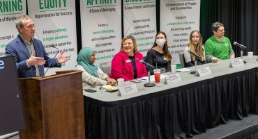 (Panelists at table, from left) Zeineb Yousif, digital initiatives librarian at the Chester Fritz Library; Cassie Gerhardt, senior associate vice president for Student Affairs; Beth Valentine, equity, compliance and education manager, Office of Equal Opportunity and Title IX; Casia Steinhaus, physics major and undergraduate research assistant; and Nathaniel Johnson, assistant professor of Nutrition and Dietetics, respond to moderator Ryan Zerr, associate vice president for Strategy & Implementation, at the ‘Celebrate UND LEADS: An update on the Strategic Plan’ event in the Memorial Union on Feb. 25. Photo by Tom Dennis/UND Today.