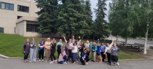 Educators attending 2025 IDEAS workshop pose in a group photo outside on the UAF campus
