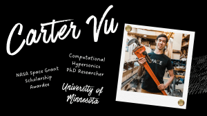 Carter Vu smiling, holding large tool in research lab