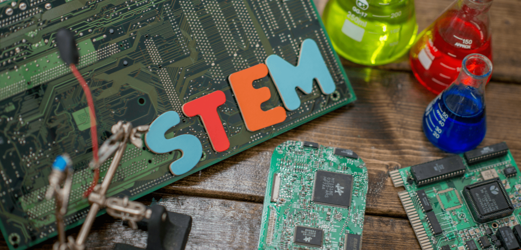 computer motherboard, chemistry solutions in beakers, stem spelled out in letters