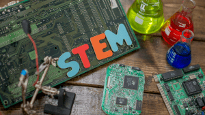computer motherboard, chemistry solutions in beakers, stem spelled out in letters