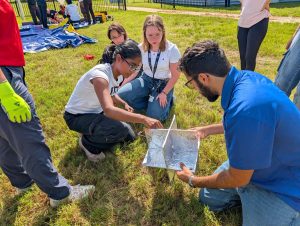 Embry‑Riddle student Whitney Melick was selected to attend the four-day Space Trek Academy, sponsored by NASA Florida Space Grant Consortium and held at the Center for Space Education at Kennedy Space Center Visitor Complex. Here, Melick (center with lanyard) works with her teammates to successfully launch a weather balloon.