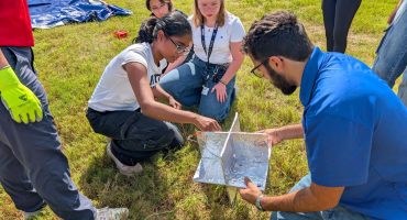 Embry‑Riddle student Whitney Melick was selected to attend the four-day Space Trek Academy, sponsored by NASA Florida Space Grant Consortium and held at the Center for Space Education at Kennedy Space Center Visitor Complex. Here, Melick (center with lanyard) works with her teammates to successfully launch a weather balloon.