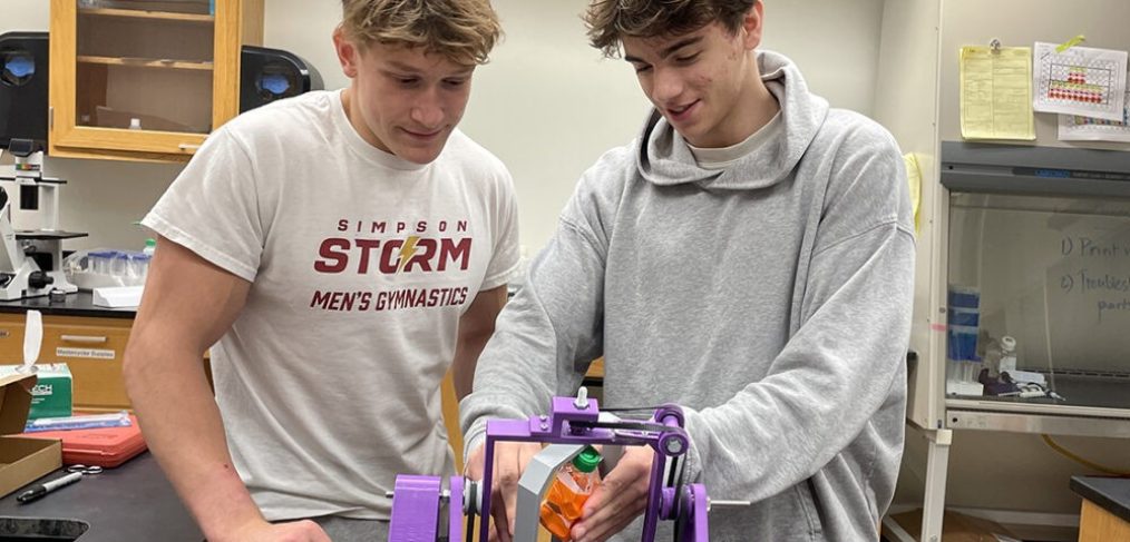 Simpson College students Brian Rollison, left, and Brennan Voss are conducting conducting research into impacts of different kinds of gravity on single-cell organisms.