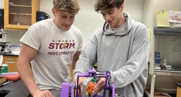Simpson College students Brian Rollison, left, and Brennan Voss are conducting conducting research into impacts of different kinds of gravity on single-cell organisms.