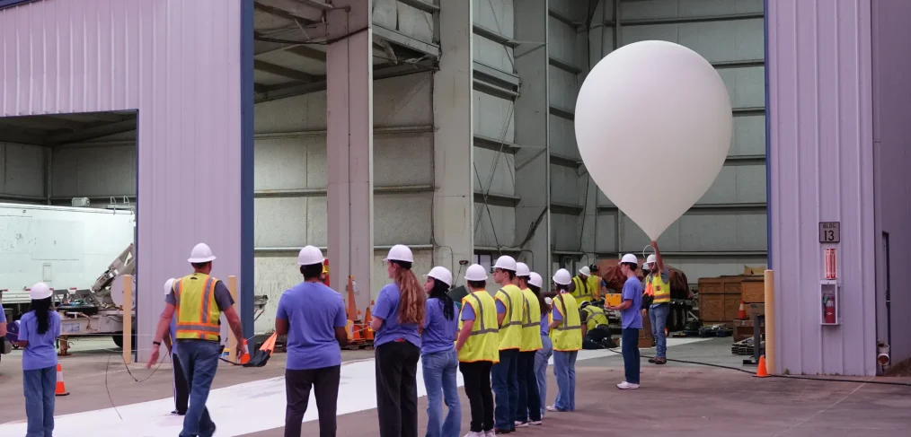 Students launching payloads on scientific balloon