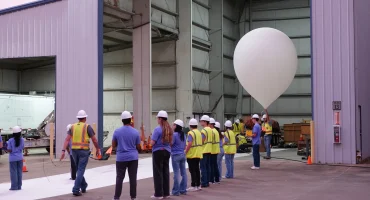 Students launching payloads on scientific balloon
