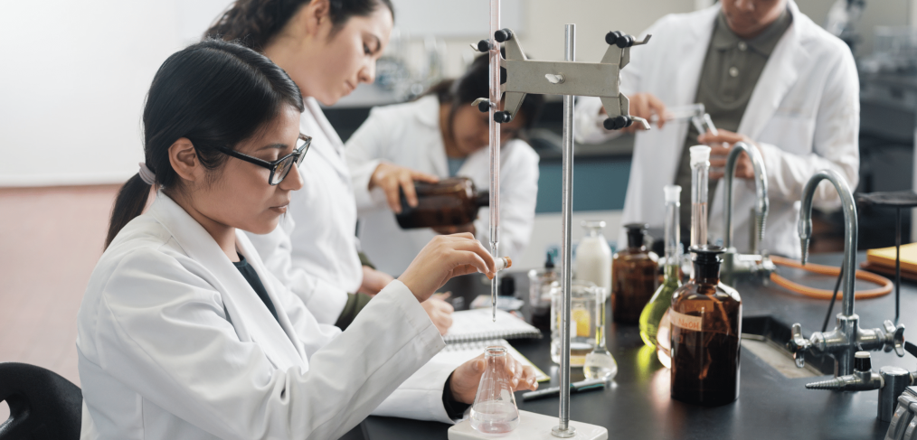 College student researchers in a chemistry lab