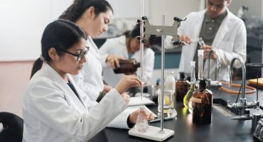 College student researchers in a chemistry lab